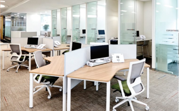 Professional office furniture installation crew at work — Total Office Furniture